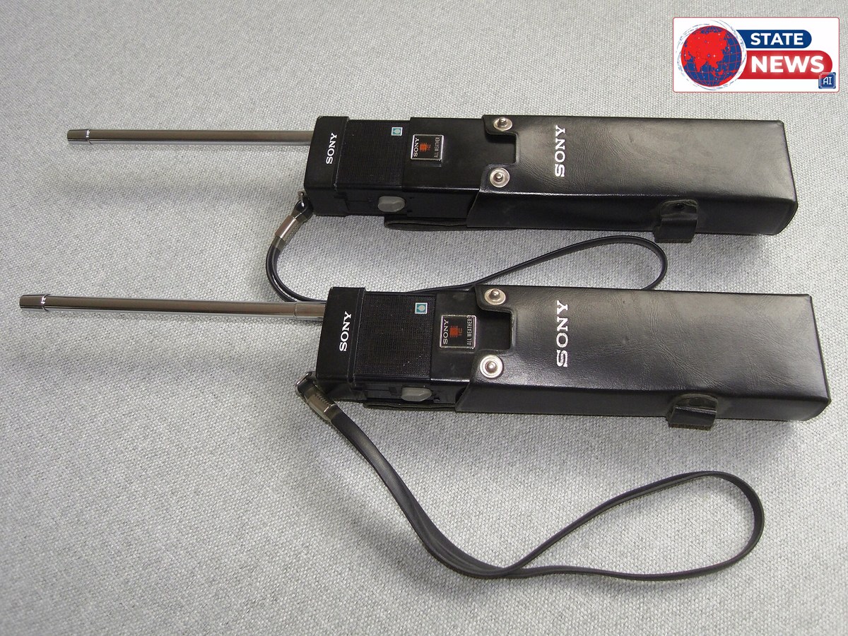 Two Sony walkie-talkie transceivers in leather cases