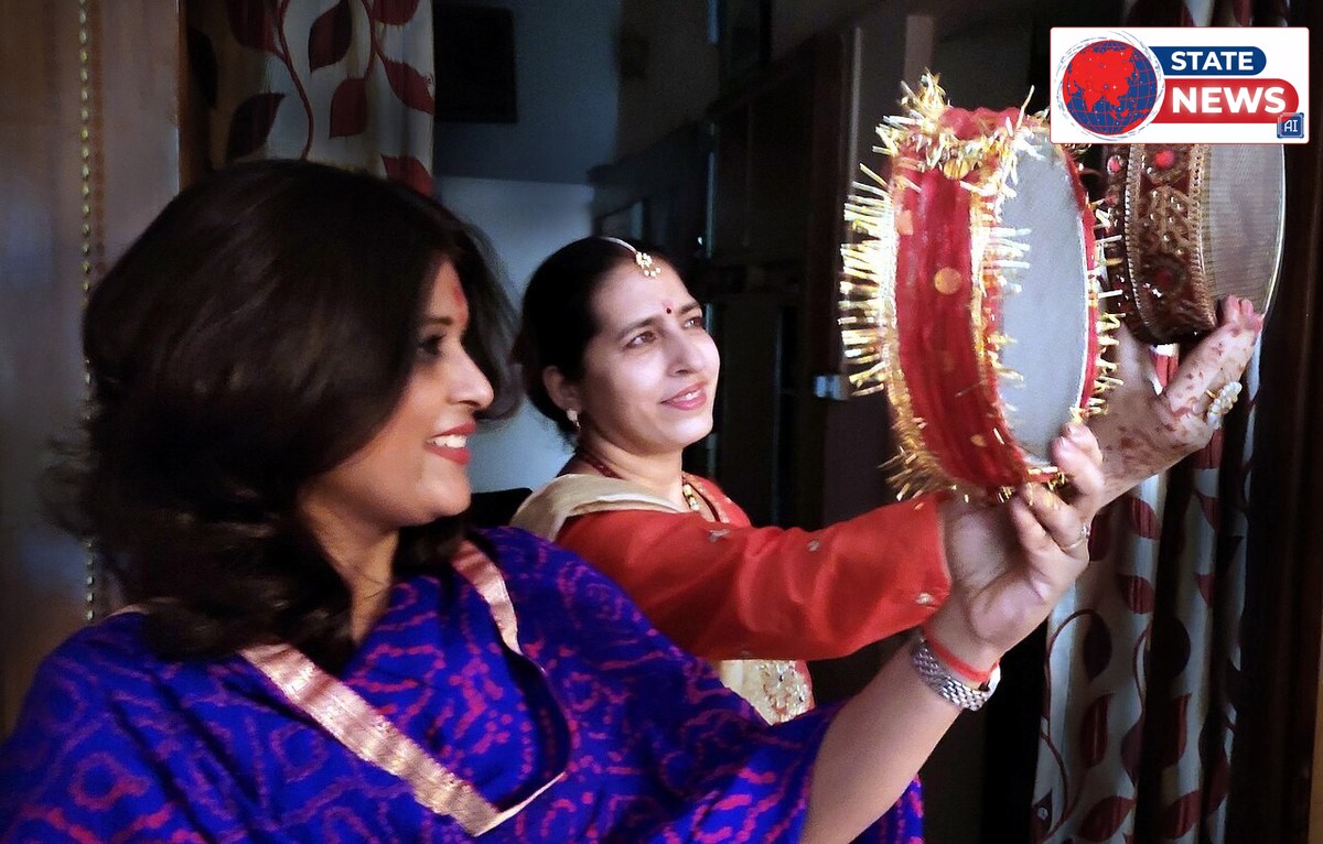 Women holding decorated sieves on Karva Chauth